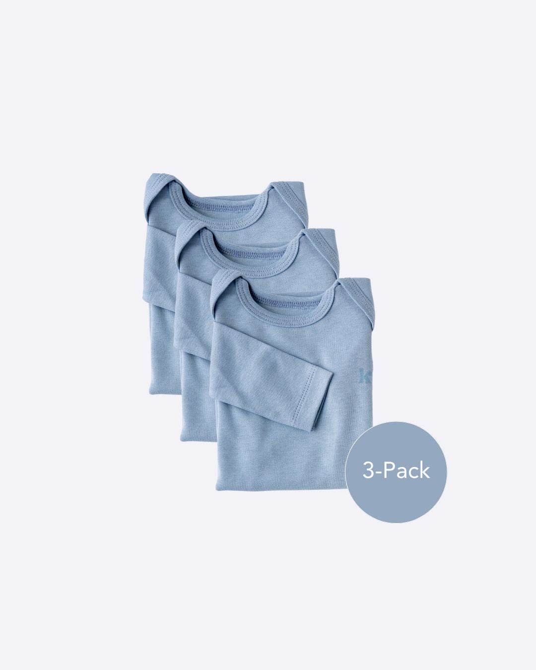 Three dusty blue long sleeve bodysuits folded and stacked