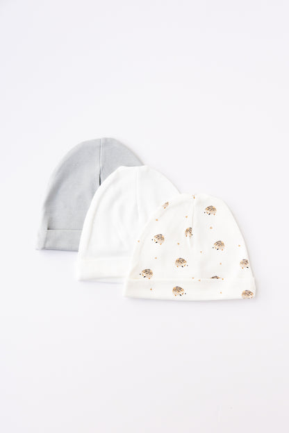 Three baby hats in grey, white and Hedgehog Meadow print