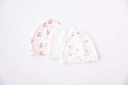 Three baby hats in white and Winter Floral print
