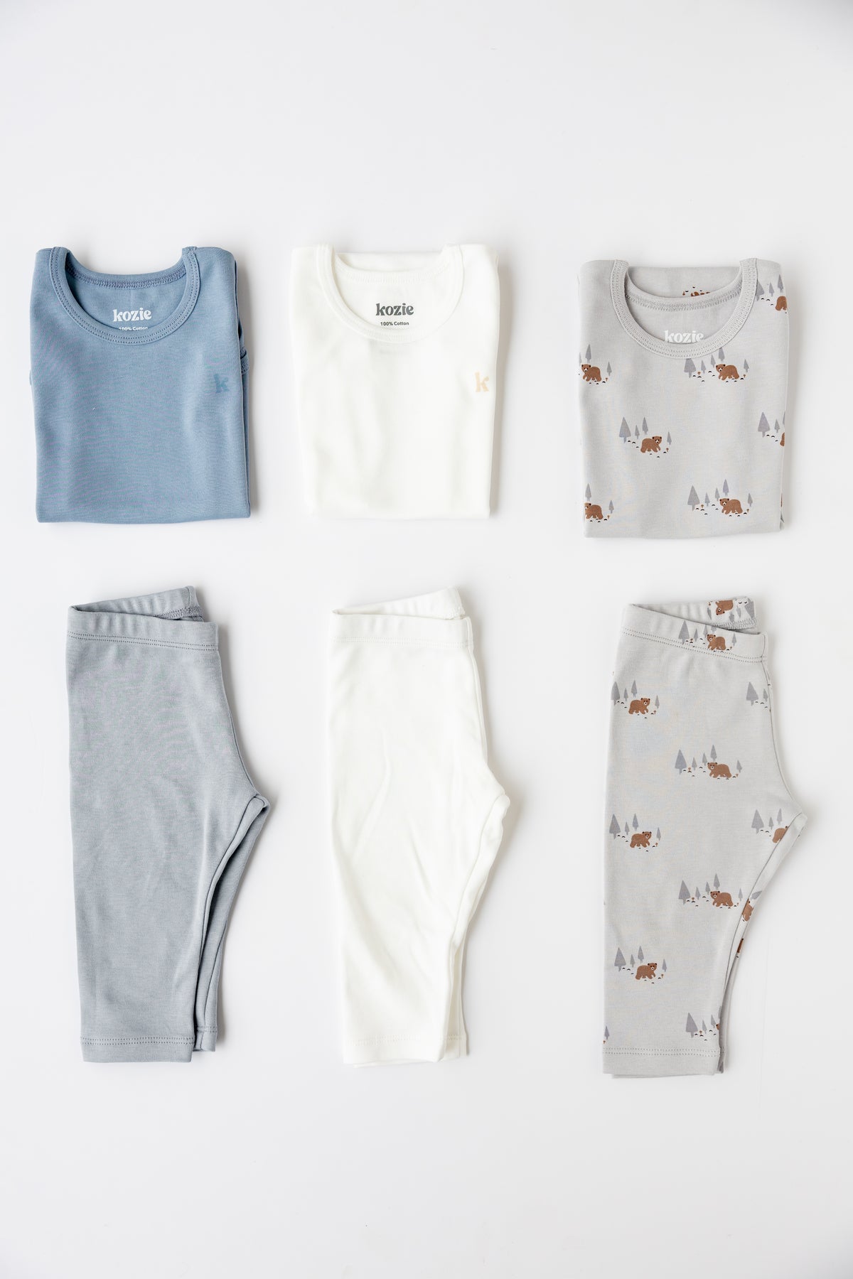 The Daily Rotation Bundle laid out — three sleeveless bodysuits and three leggings