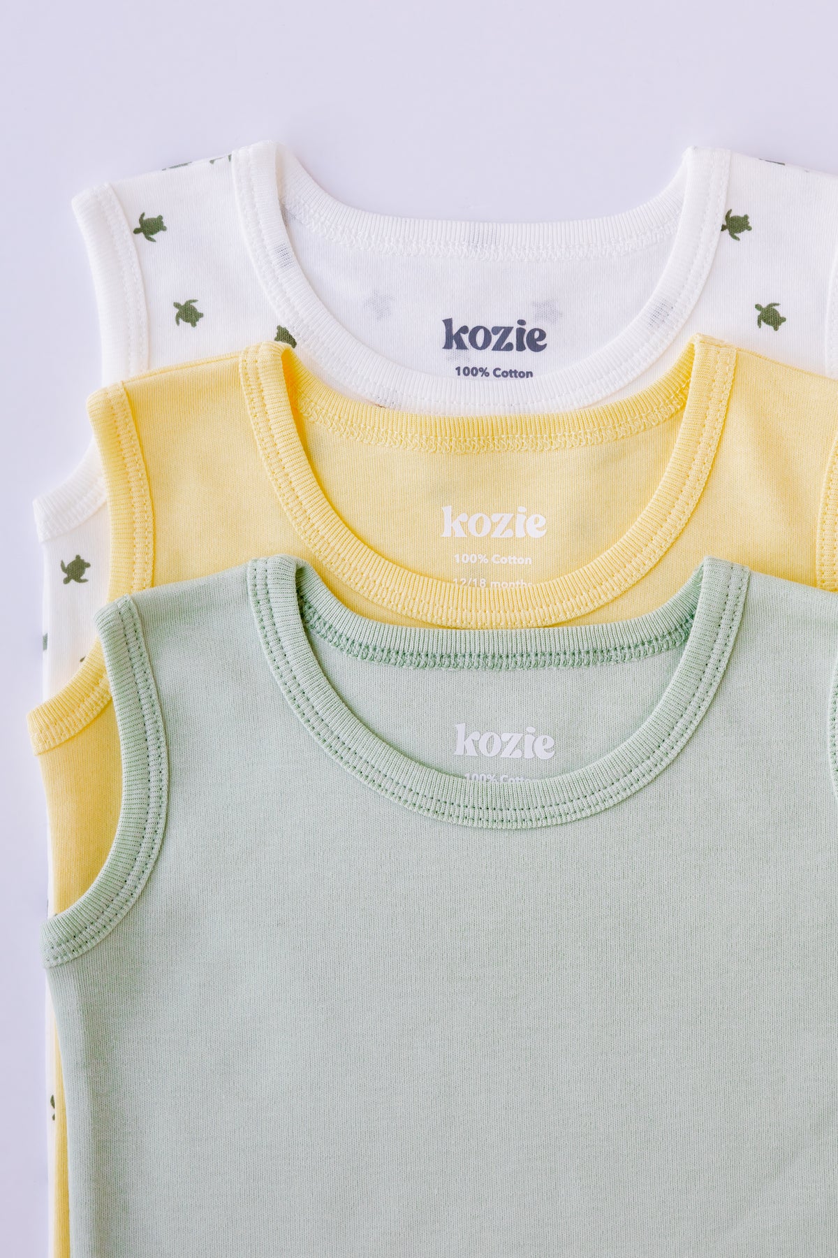 Turtle Bay sleeveless bodysuits folded in sage and yellow