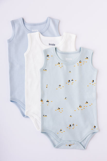 Three sleeveless bodysuits in sky blue, white and Blue Sails print