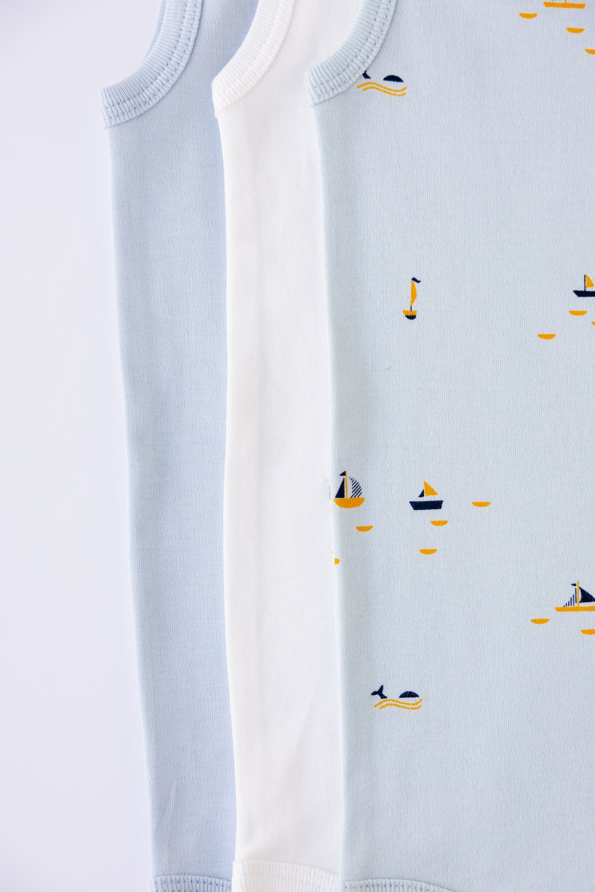 Close-up of the Blue Sails print on a sky blue sleeveless bodysuit