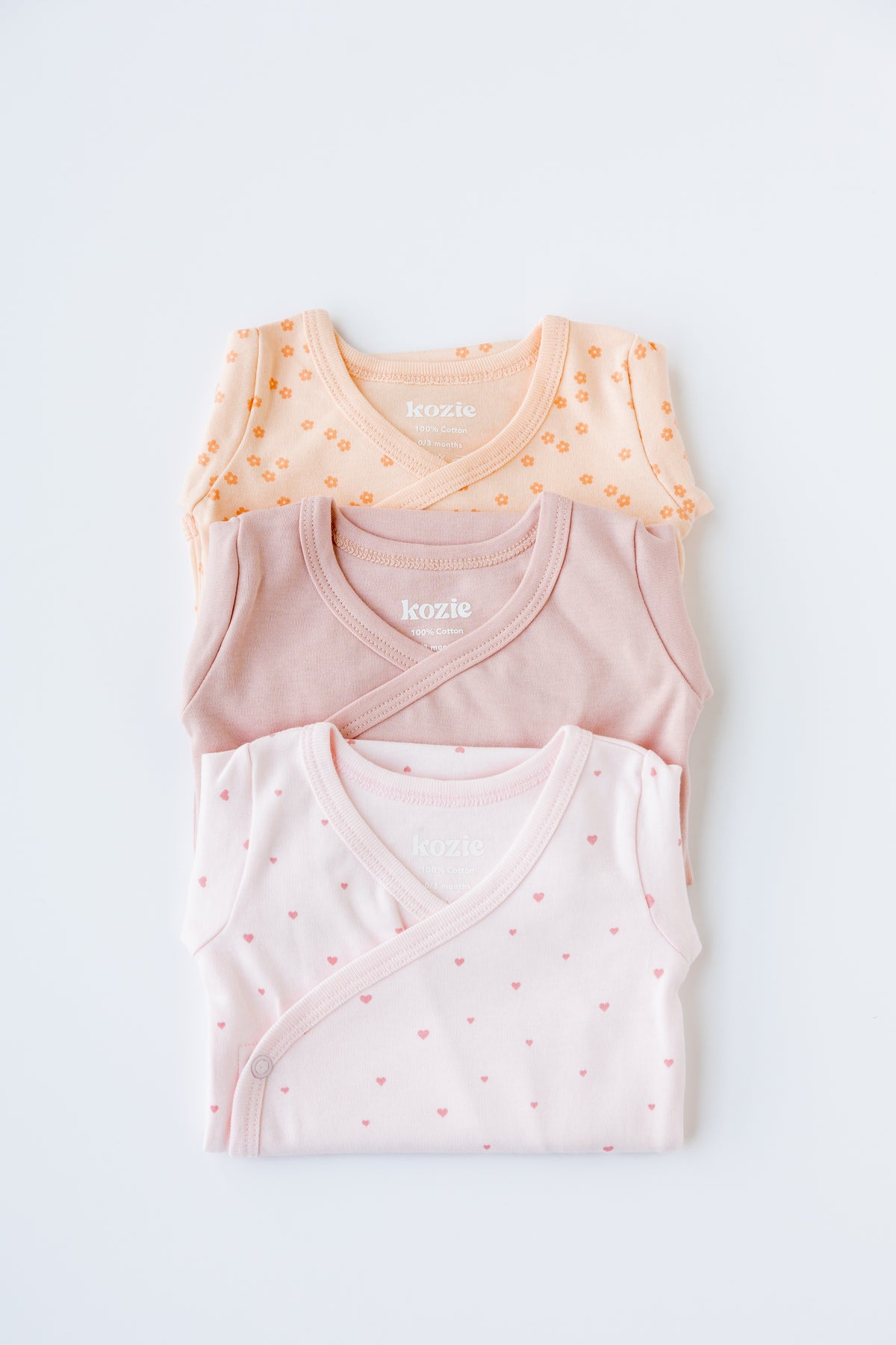 Three long sleeve kimono bodysuits in blush, cream and Sweet Hearts print