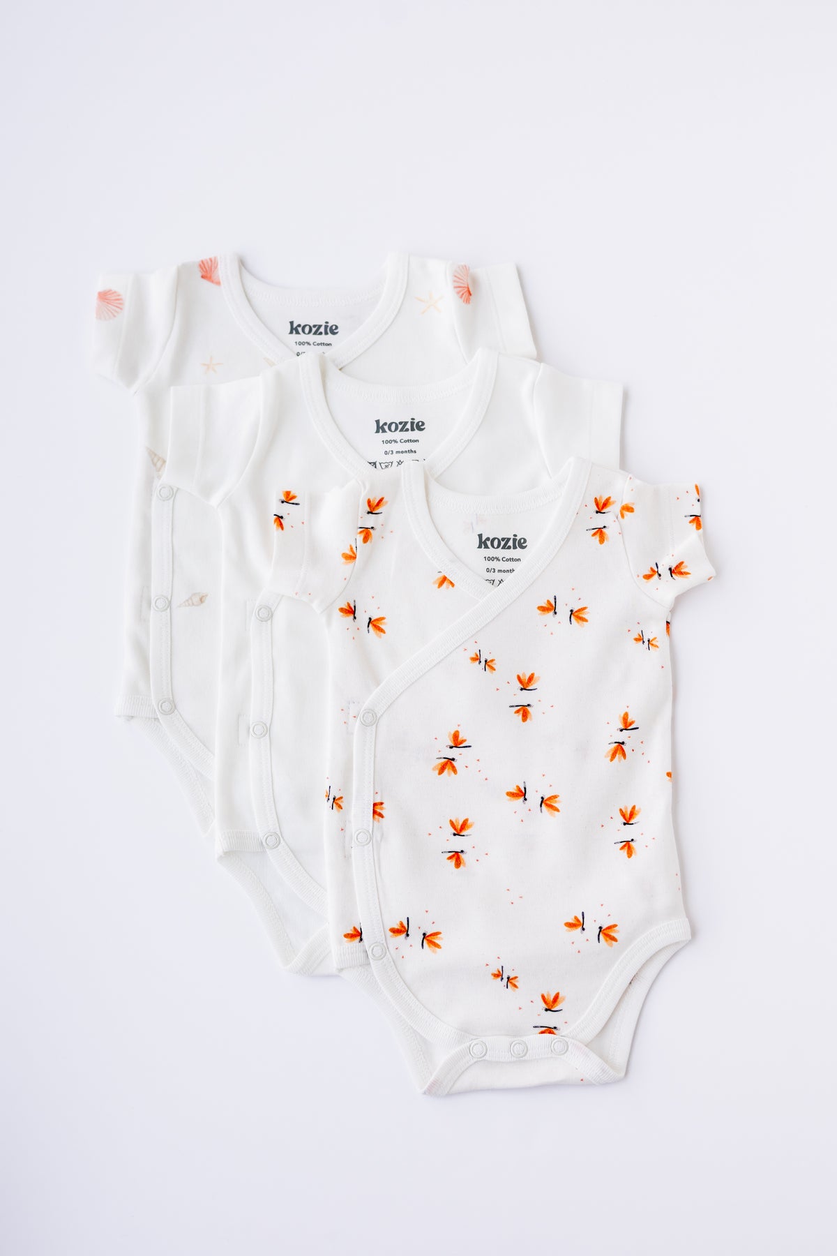Three short sleeve kimono bodysuits in white and Coastal Day Dream print