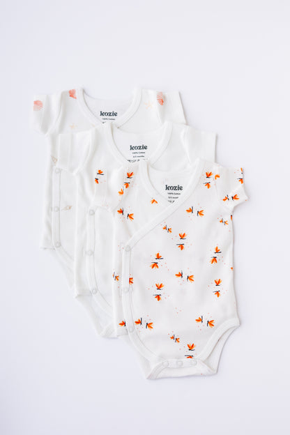 Three short sleeve kimono bodysuits in white and Coastal Day Dream print