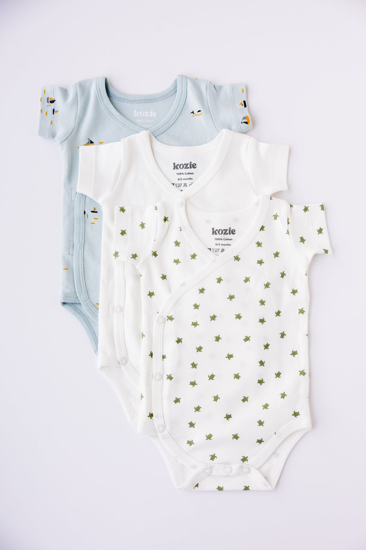 Three short sleeve kimono bodysuits in mint, white and Sea Life print