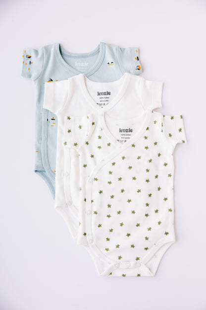 Three short sleeve kimono bodysuits in mint, white and Sea Life print