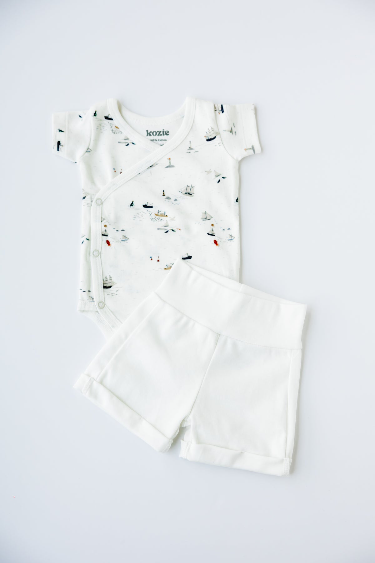 Little Voyage print kimono bodysuit and shorts, laid flat