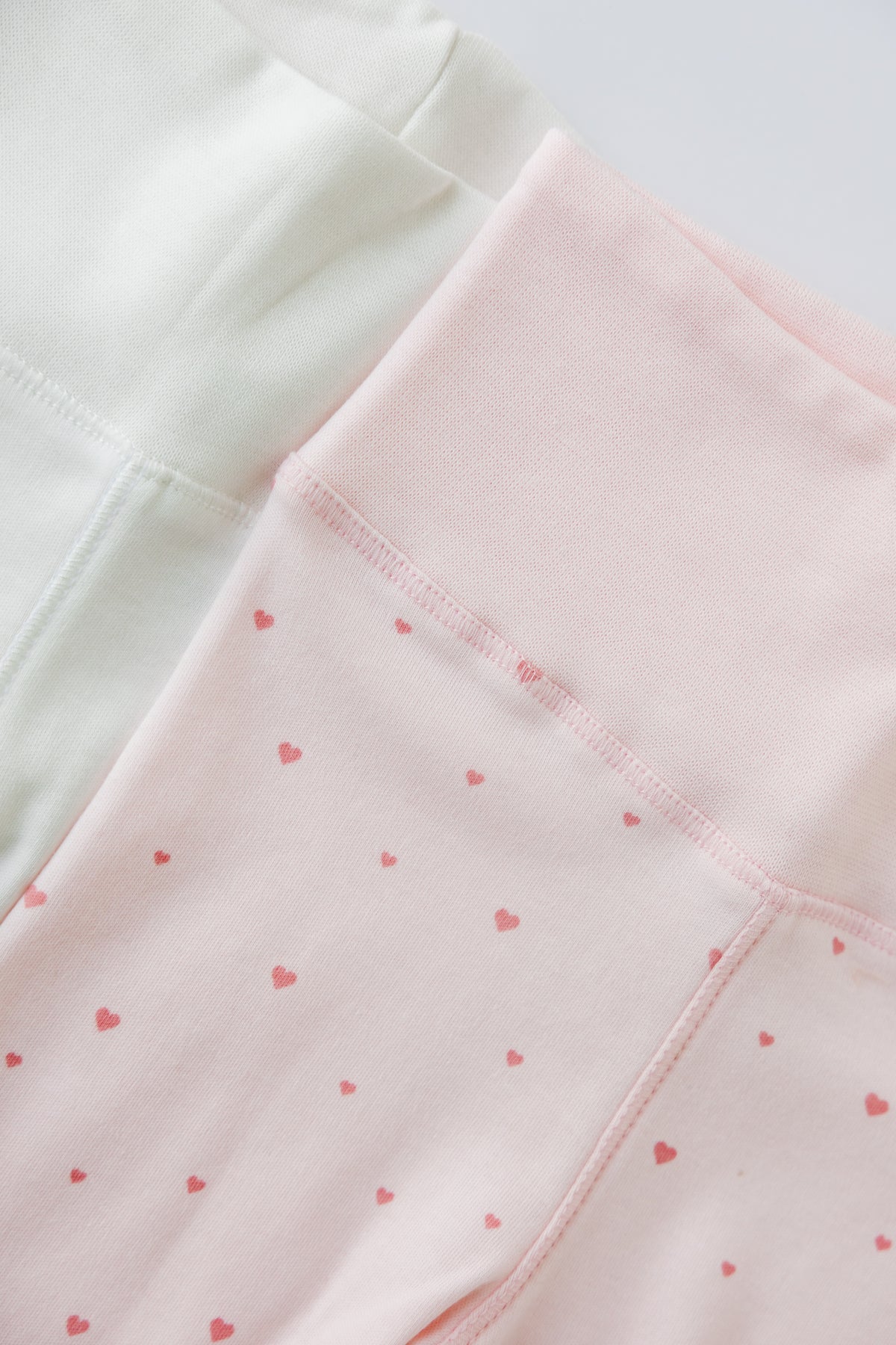 Tiny Hearts print footed leggings, laid flat