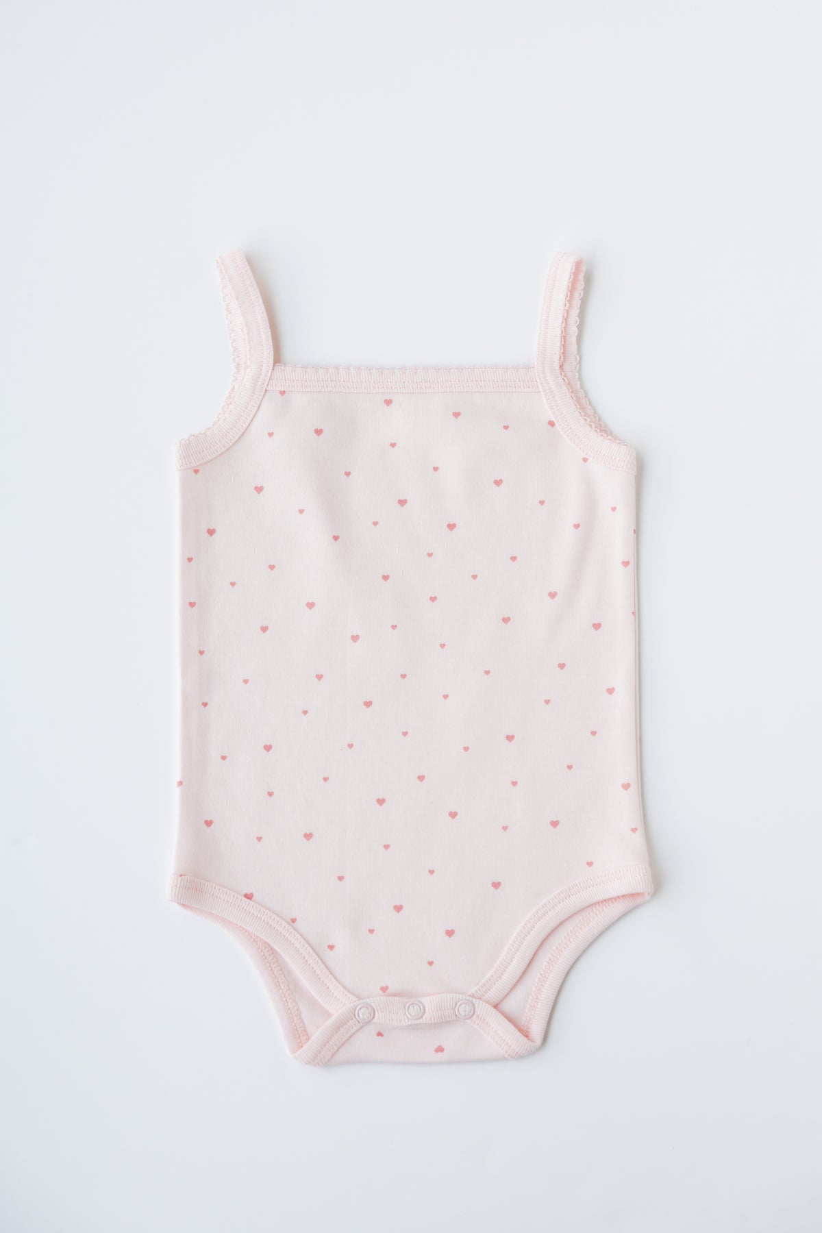 Sleeveless bodysuit in the Tiny Love print, shown flat