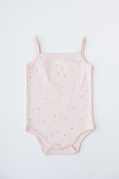 Sleeveless bodysuit in the Tiny Love print, shown flat