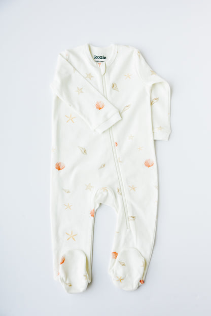 Sea Shells print footed zipper sleepsuit in white, laid flat