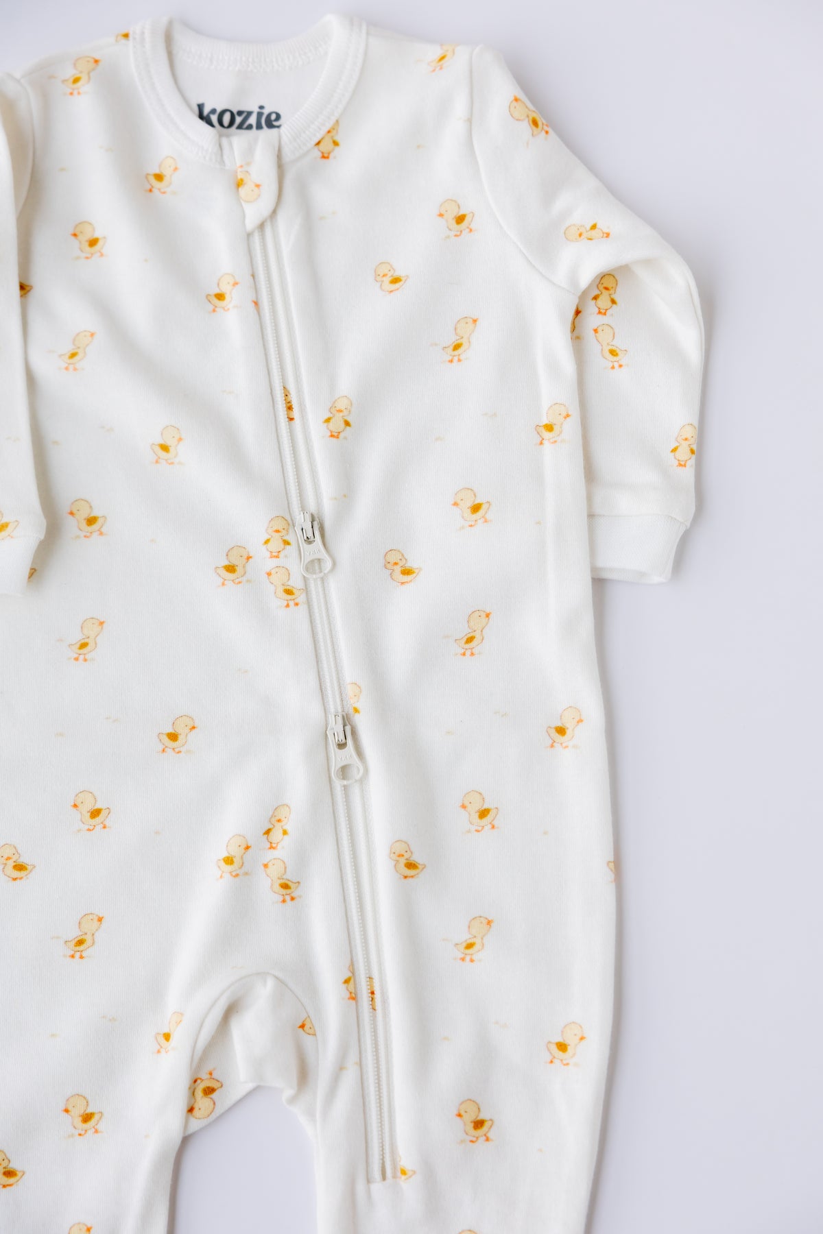 Ducky Days two-way zipper sleepsuit showing the full-length zip