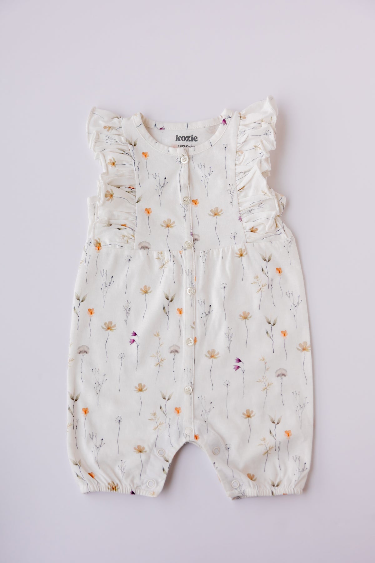 Wildflower print ruffle romper in white, laid flat