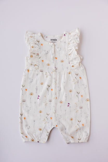 Wildflower print ruffle romper in white, laid flat