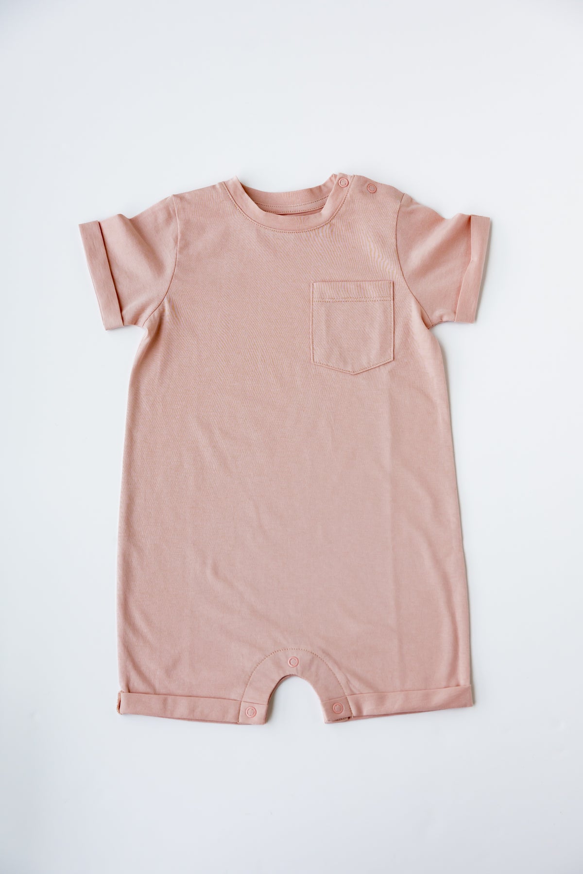 Cashmere short sleeve romper, laid flat