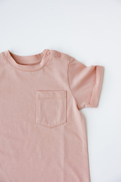 Close-up of the front pocket on the cashmere short sleeve romper