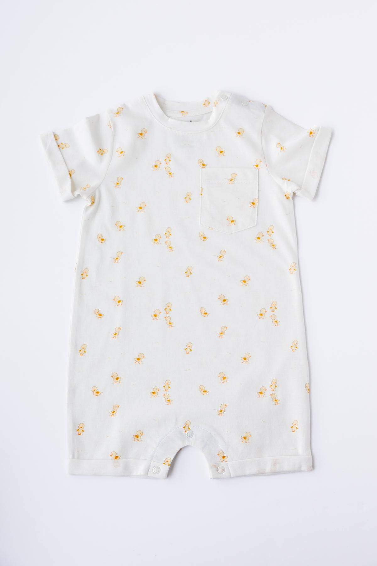 Ducky Days print short sleeve romper in white, laid flat