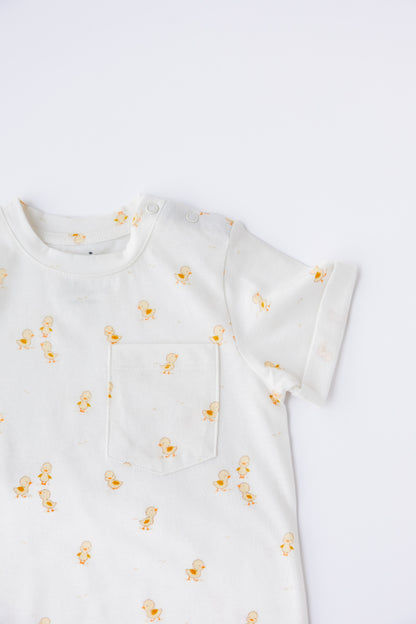 Close-up of the Ducky Days duck print on the short sleeve romper