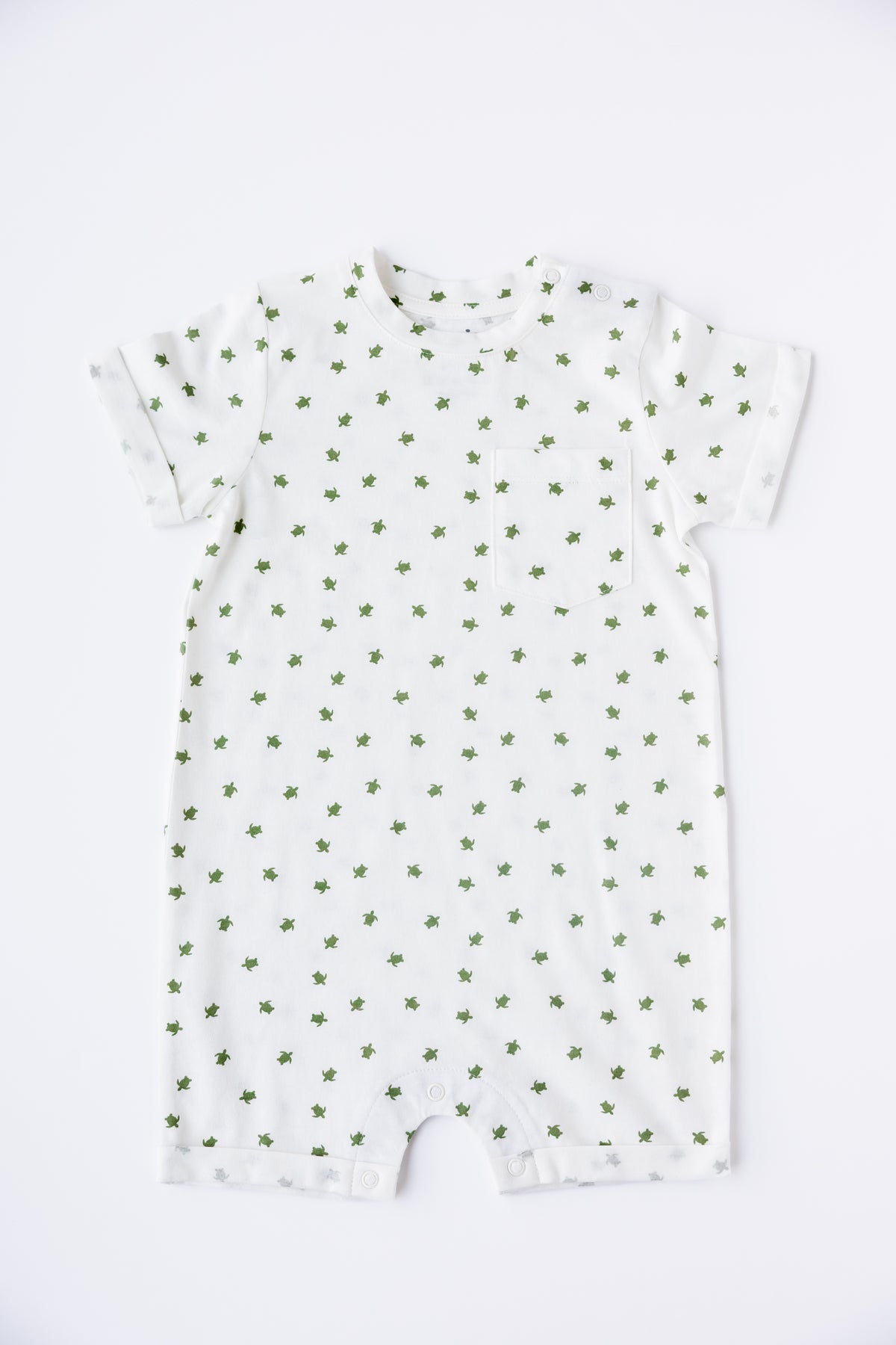 Turtle Bay print short sleeve romper in white, laid flat
