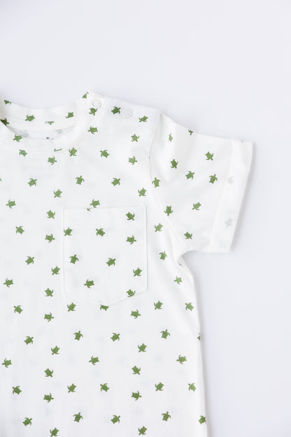 Close-up of the Turtle Bay print on the short sleeve romper