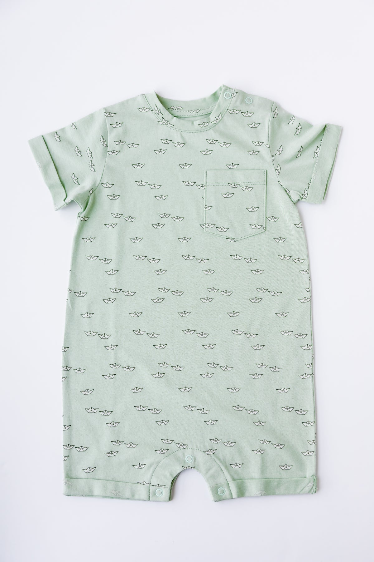 Paper Boats print short sleeve romper in sage, laid flat