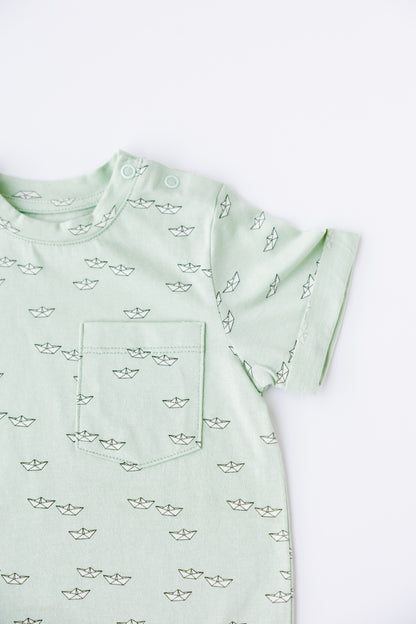 Close-up of the Paper Boats print on the sage romper