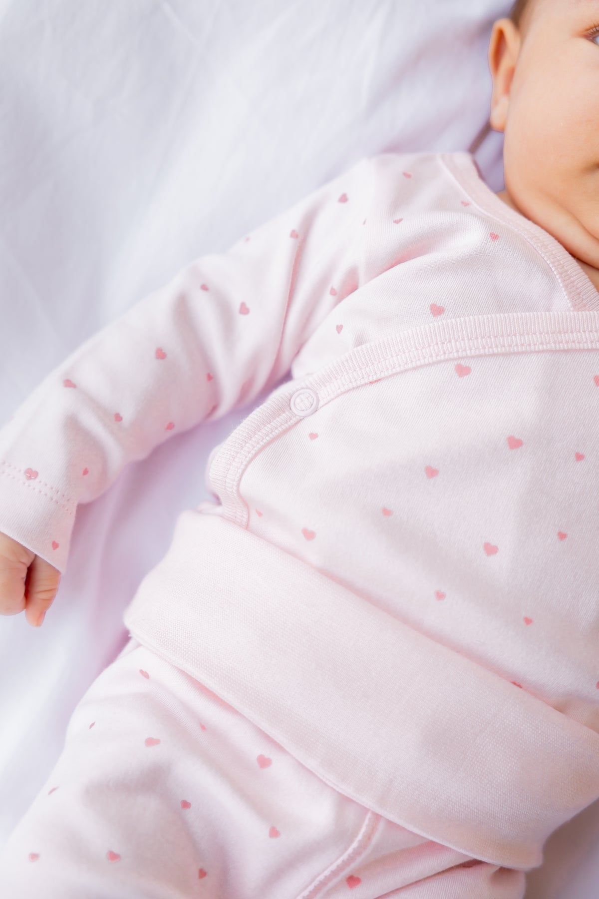 Close-up of a baby in the Tiny Hearts footed leggings
