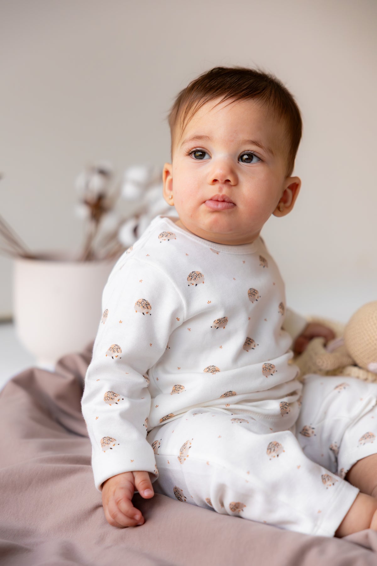 Baby sitting in the Hedgehog Meadow long sleeve pyjama set
