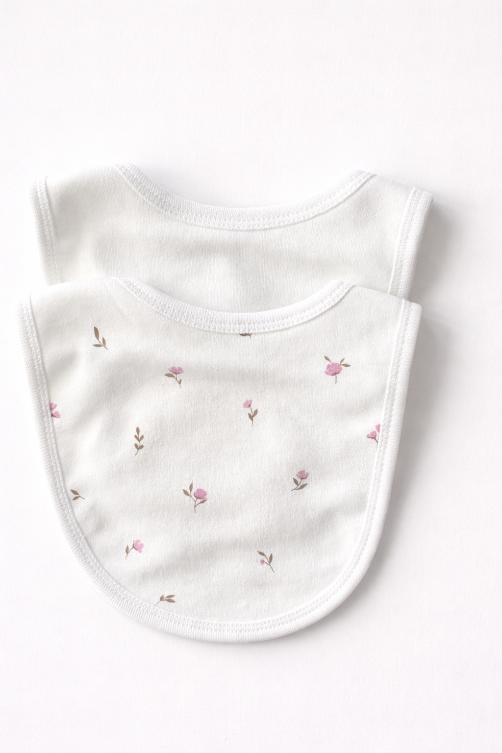 Double-layered baby bib in white with Winter Floral print