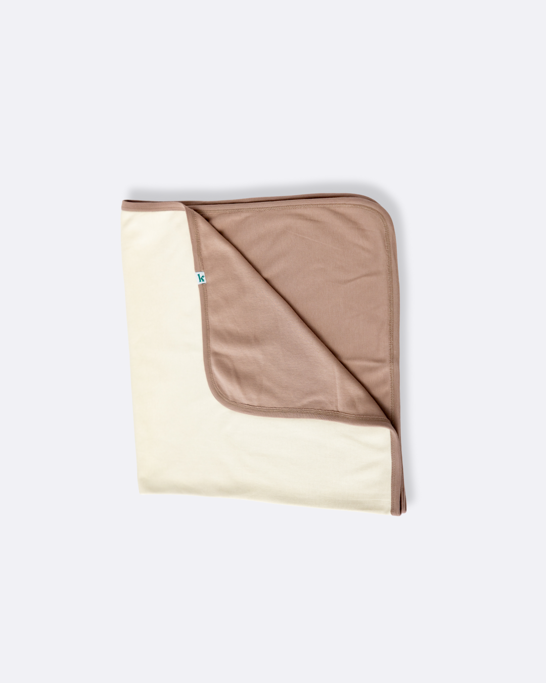 Cocoa and natural double-sided cotton baby blanket, folded to show both sides